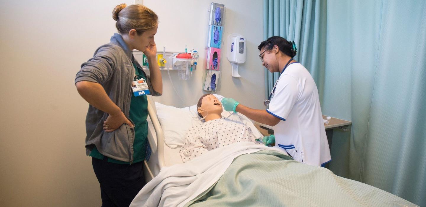 Nursing Faculty teaches patient care to nursing student
